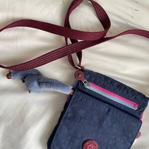 Kipling Navy Crossbody with Burgundy Strap and Pink Zipper Accents